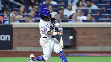 Sep 17, 2024; New York City, New York, USA; New York Mets shortstop Luisangel Acuna (2) hits a solo home run against the Washington Nationals during the eighth inning at Citi Field. The home run was the first of his major league career. Mandatory Credit: Brad Penner-Imagn Images
