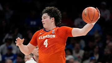 Mar 14, 2025; Charlotte, NC, USA; Clemson Tigers forward Ian Schieffelin (4) with the ball in the first half at Spectrum Center. Mandatory Credit: Bob Donnan-Imagn Images