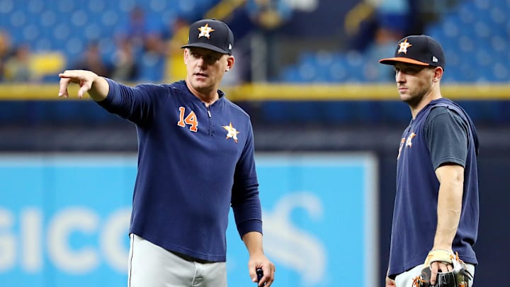 Oct 7, 2019; St. Petersburg, FL, USA; Houston Astros manager AJ Hinch (14) talks with third baseman Alex Bregman (2) during warmups before the game against the Tampa Bay Rays in game three of the 2019 ALDS playoff baseball series at Tropicana Field. 