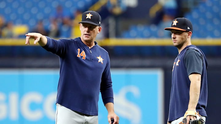 Oct 7, 2019; St. Petersburg, FL, USA; Houston Astros manager AJ Hinch (14) talks with third baseman Alex Bregman (2) during warmups before the game against the Tampa Bay Rays in game three of the 2019 ALDS playoff baseball series at Tropicana Field.