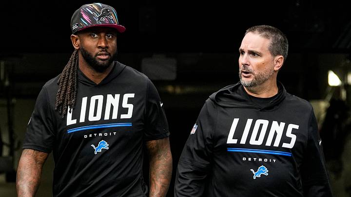 Detroit Lions defensive coordinator Kelvin Sheppard, left, outside linebackers coach David Corrao walk on to the field for warmup ahead of the game between Arizona Cardinals and Detroit Lions at State Farm Stadium in Glendale, Arizona on Sunday, Oct. 11, 2026.