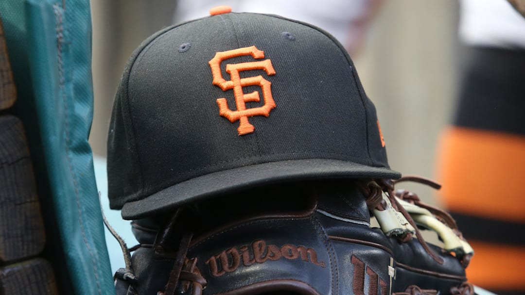 Jul 14, 2023; Pittsburgh, Pennsylvania, USA; San Francisco Giants hat and glove on the bench against the Pittsburgh Pirates during the first inning at PNC Park. Jul 14, 2023; Pittsburgh, Pennsylvania, USA; San Francisco Giants hat and glove on the bench against the Pittsburgh Pirates during the first inning at PNC Park.