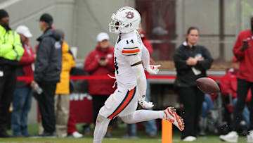 Oct 25, 2025; Fayetteville, Arkansas, USA; Auburn Tigers cornerback Rayshawn Pleasant (14) returns an interception for a touchdown during the fourth quarter against the Arkansas Razorbacks at Donald W. Reynolds Razorback Stadium. Mandatory Credit: Nelson Chenault-Imagn Images