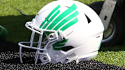 Sep 14, 2024; Lubbock, Texas, USA;  A North Texas Mean Green helmet on the turf in the first half during the game against the Texas Tech Red Raiders at Jones AT&T Stadium and Cody Campbell Field. Mandatory Credit: Michael C. Johnson-Imagn Images