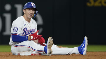 Jul 22, 2024; Arlington, Texas, USA; Texas Rangers left fielder Wyatt Langford (36) sits on second base after hitting a double during the ninth inning against the Chicago White Sox at Globe Life Field. Mandatory Credit: Raymond Carlin III-USA TODAY Sports