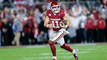 Nov 23, 2024; Norman, Oklahoma, USA; Oklahoma Sooners quarterback Jackson Arnold (11) runs the ball during the fourth quarter against the Alabama Crimson Tide at Gaylord Family-Oklahoma Memorial Stadium. Mandatory Credit: William Purnell-Imagn Images