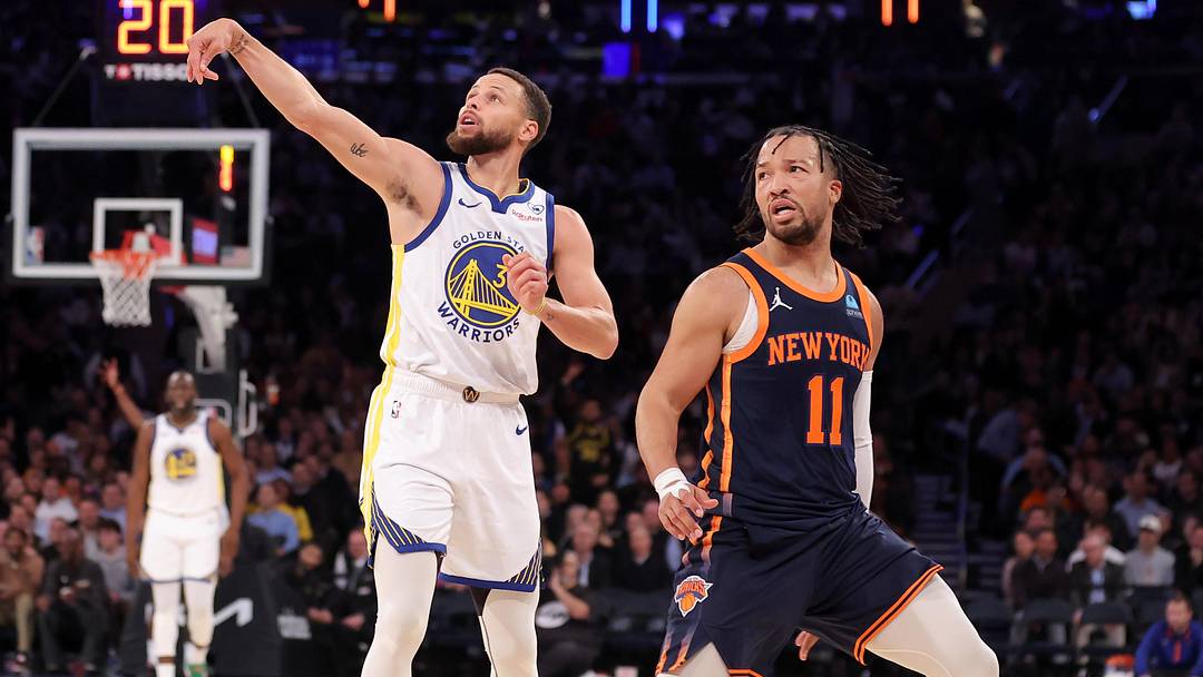 Feb 29, 2024; New York, New York, USA; Golden State Warriors guard Stephen Curry (30) watches his three point shot against New York Knicks guard Jalen Brunson (11) during the third quarter at Madison Square Garden. Mandatory Credit: Brad Penner-Imagn Images