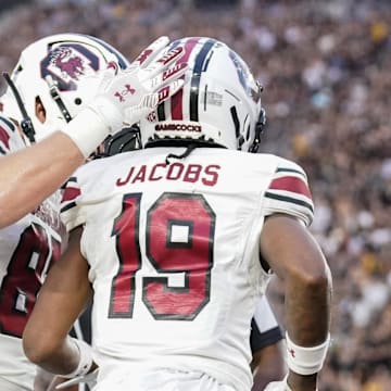 Sep 20, 2025; Columbia, Missouri, USA; South Carolina Gamecocks wide receiver Vandrevius Jacobs (19) celebrates with team mates after scoring against the Missouri Tigers during the first half of the game at Faurot Field at Memorial Stadium. Mandatory Credit: Denny Medley-Imagn Images