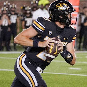 Aug 31, 2023; Columbia, Missouri, USA; Missouri Tigers quarterback Sam Horn (21) runs the ball against the South Dakota Coyotes during the game at Faurot Field at Memorial Stadium. Mandatory Credit: Denny Medley-Imagn Images