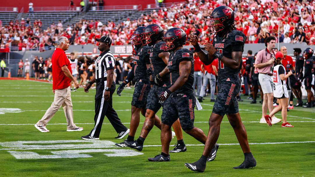 Sep 11, 2026; Raleigh, North Carolina, USA; NC State Wolfpack NC State Wolfpack cornerback Brian Nelson II #7, linebacker Popo Aguirre #0, running back Jayden Scott #1 and quarterback CJ Bailey #11 walk out for the coin toss before the first half of the game against Richmond Spiders at Carter-Finley Stadium. Mandatory Credit: Jaylynn Nash-Imagn Images Sep 11, 2026; Raleigh, North Carolina, USA; NC State Wolfpack NC State Wolfpack cornerback Brian Nelson II #7, linebacker Popo Aguirre #0, running back Jayden Scott #1 and quarterback CJ Bailey #11 walk out for the coin toss before the first half of the game against Richmond Spiders at Carter-Finley Stadium. Mandatory Credit: Jaylynn Nash-Imagn Images