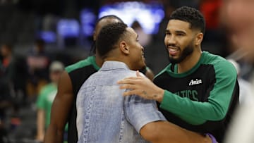 Oct 24, 2024; Washington, District of Columbia, USA; Boston Celtics guard Jaylen Brown (R) hugs Washington Wizards guard Malcolm Brogdon (L) after their game at Capital One Arena. Mandatory Credit: Geoff Burke-Imagn Images