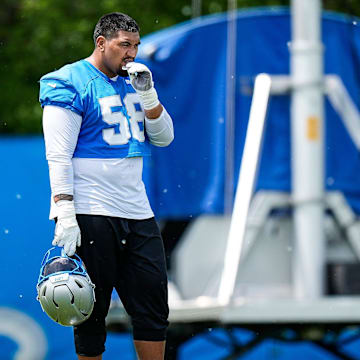 Detroit Lions offensive tackle Penei Sewell (58) watches practice during OTA at Meijer Performance Center in Allen Park on Friday, May 30, 2025.