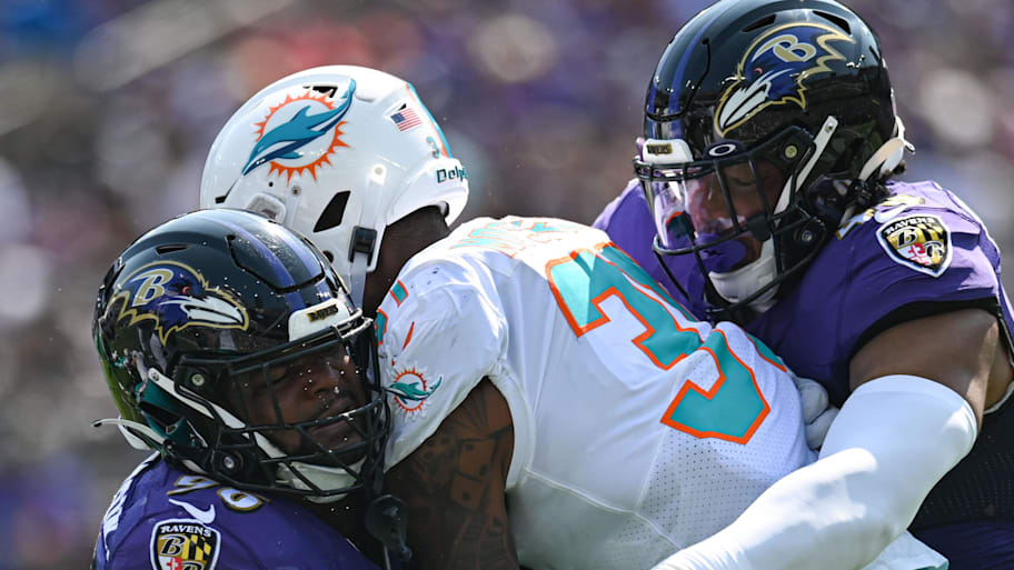 Ravens tackle Dolphins runnig back.