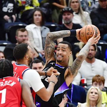 Feb 13, 2025; Salt Lake City, Utah, USA; LA Clippers guard Norman Powell (24), guard James Harden (1), and guard/forward Ben Simmons (25) defend Utah Jazz forward/center John Collins (20) during the second half at the Delta Center. Mandatory Credit: Christopher Creveling-Imagn Images
