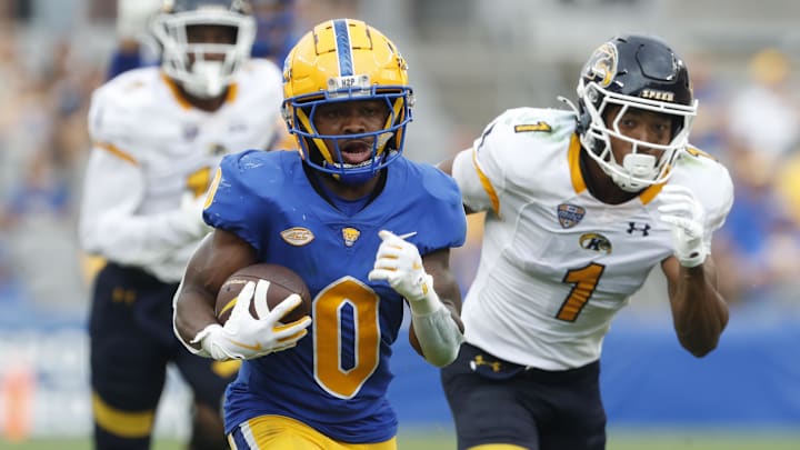 Aug 31, 2024; Pittsburgh, Pennsylvania, USA;  Pittsburgh Panthers running back Desmond Reid (0) runs on his way to scoring a touchdown against the Kent State Golden Flashes during the third quarter at Acrisure Stadium. Pittsburgh won 55-24. Mandatory Credit: Charles LeClaire-Imagn Images