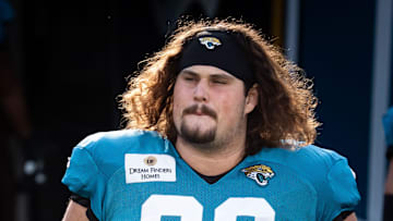 Jacksonville Jaguars center Jonah Monheim (60) runs out out of the tunnel during Helmet Walk before an NFL scrimmage at EverBank Stadium Friday August 1, 2025, in Jacksonville, Fla. 
