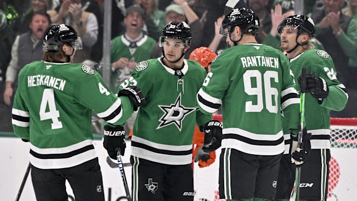 Nov 6, 2025; Dallas, Texas, USA; Dallas Stars defenseman Miro Heiskanen (4) and center Wyatt Johnston (53) and right wing Mikko Rantanen (96) and center Roope Hintz (24) celebrates a power play goal scored by Johnston against the Anaheim Ducks during the first period at the American Airlines Center. Mandatory Credit: Jerome Miron-Imagn Images