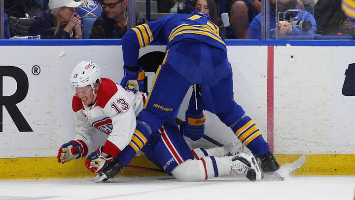 May 6, 2026; Buffalo, New York, USA; Buffalo Sabres center Tage Thompson (72) checks Montréal Canadiens right wing Cole Caufield (13) as he goes after a loose puck during the third period in game one of the second round of the 2026 Stanley Cup Playoffs at KeyBank Center. Mandatory Credit: Timothy T. Ludwig-Imagn Images