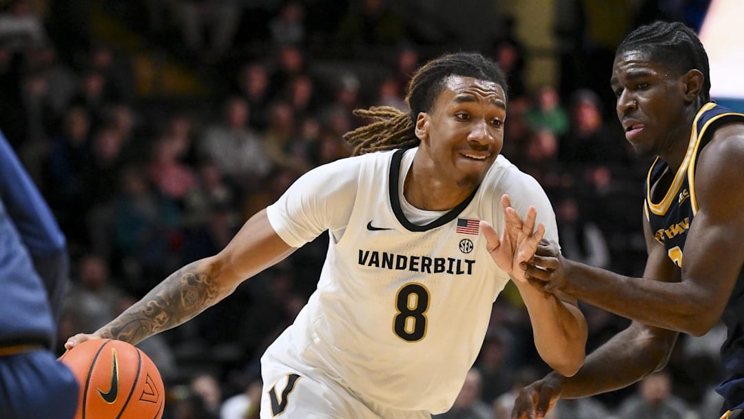 Dec 29, 2025; Nashville, Tennessee, USA;  Vanderbilt Commodores guard Tyler Harris (8) drives to the basket against the New Haven Chargers during the first half at Memorial Gymnasium. Mandatory Credit: Steve Roberts-Imagn Images