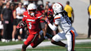 Louisville’s Caullin Lacy runs against Virginia’s Ja’Son Prevard at L&N Stadium on Saturday, Oct. 4, 2025