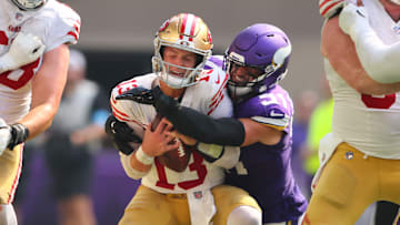 San Francisco 49ers quarterback Brock Purdy is sacked by Minnesota Vikings defender Blake Cashman