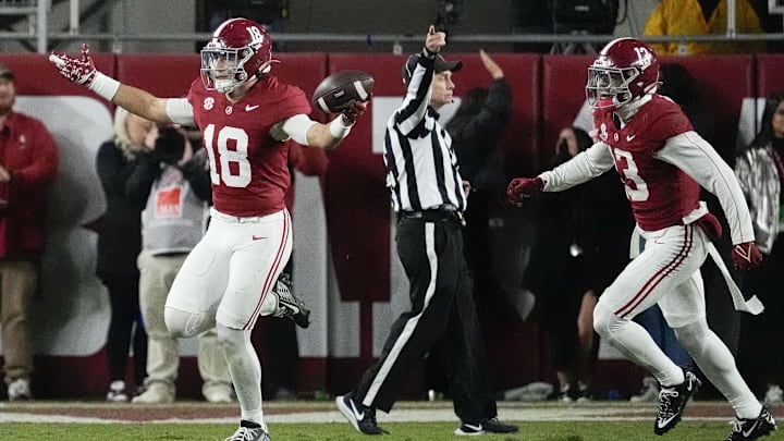 Nov 30, 2024; Tuscaloosa, Alabama, USA;  Alabama Crimson Tide defensive back Bray Hubbard (18) celebrates with defensive back Malachi Moore (13) after intercepting a pass against the Auburn Tigers during the second half at Bryant-Denny Stadium. Alabama won 28-14. Mandatory Credit: Gary Cosby Jr.-Imagn Images