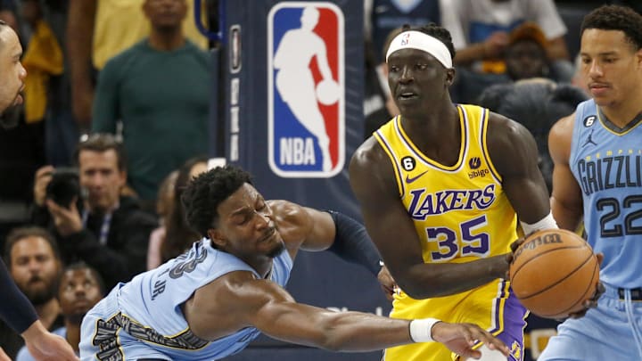 Apr 26, 2023; Memphis, Tennessee, USA; Los Angeles Lakers forward Wenyen Gabriel (35) handles the ball as Memphis Grizzlies forward Jaren Jackson Jr. (13) defends during the second half during game five of the 2023 NBA playoffs at FedExForum. Mandatory Credit: Petre Thomas-Imagn Images