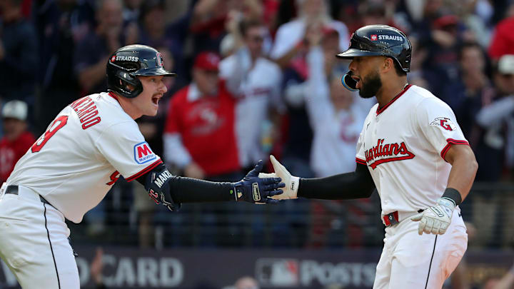 Cleveland Guardians right fielder George Valera (35) celebrates with Kyle Manzardo (9) after scoring during the fourth inning of Game 3 of the American League Wild Card Series at Progressive Field, Oct. 2, 2025, in Cleveland, Ohio.