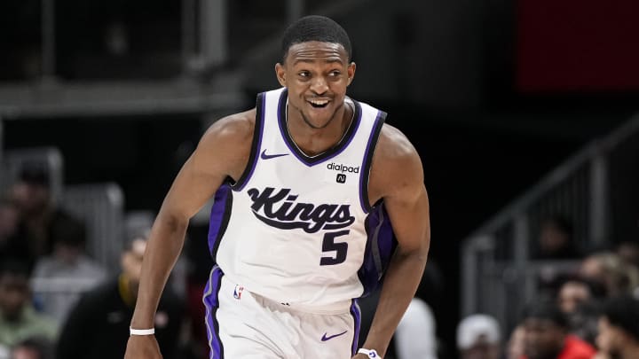 Dec 29, 2023; Atlanta, Georgia, USA; Sacramento Kings guard De'Aaron Fox (5) reacts after making a three point basket against the Atlanta Hawks during the second half at State Farm Arena. Mandatory Credit: Dale Zanine-USA TODAY Sports