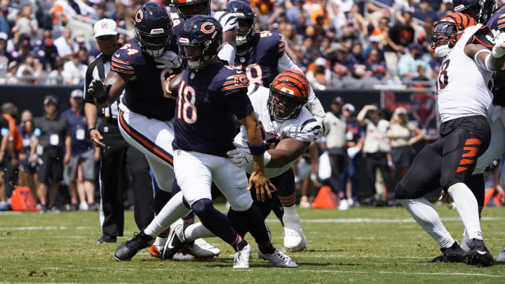 Aug 17, 2024; Chicago, Illinois, USA; Cincinnati Bengals defensive tackle Kris Jenkins Jr. (90) sacks Chicago Bears quarterback Caleb Williams (18) during the first half at Soldier Field. Mandatory Credit: David Banks-USA TODAY Sports