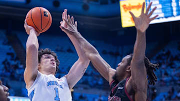 Nov 14, 2025; Chapel Hill, North Carolina, USA; North Carolina Tar Heels forward Zayden High (1) shoots on North Carolina Central Eagles forward Kelechi Okworogwo (21) during the second half at Dean E. Smith Center. Mandatory Credit: Scott Kinser-Imagn Images