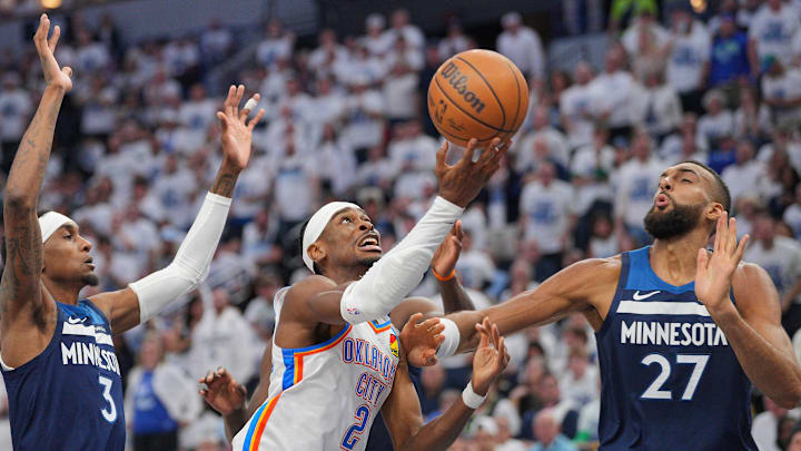 Oklahoma City Thunder guard Shai Gilgeous-Alexander (2) shoots the ball over Minnesota Timberwolves center Rudy Gobert (27) during the first half in Game 3. Oklahoma City Thunder guard Shai Gilgeous-Alexander (2) shoots the ball over Minnesota Timberwolves center Rudy Gobert (27) during the first half in Game 3.