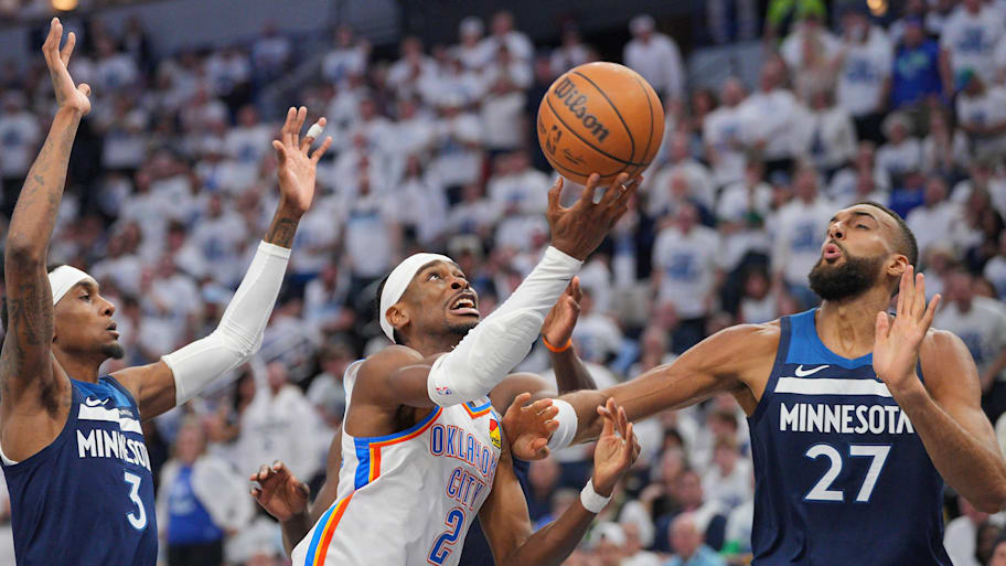 Oklahoma City Thunder guard Shai Gilgeous-Alexander (2) shoots the ball over Minnesota Timberwolves center Rudy Gobert (27) during the first half in Game 3.  | Brad Rempel-Imagn Images