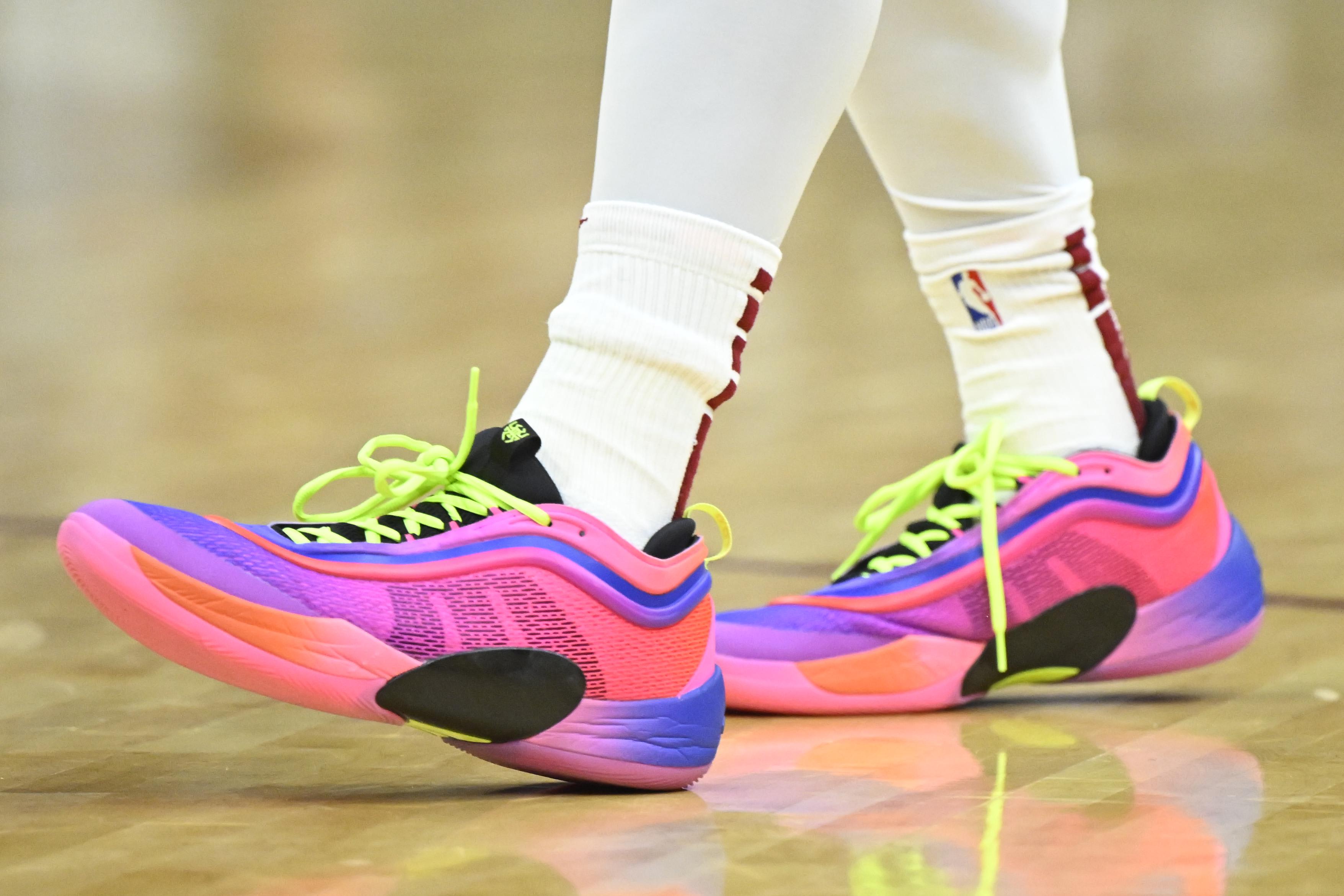 Cleveland Cavaliers guard Donovan Mitchell's pink and black adidas sneakers.