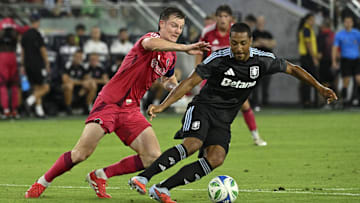 Jul 30, 2025; St. Louis, Missouri, USA; St. Louis City midfielder Chris Durkin (8) battles Aston Villa midfielder Youri Tielemans (8) for the ball in the second half at Energizer Park. Mandatory Credit: Joe Puetz-Imagn Images
