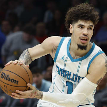 Mar 10, 2025; Miami, Florida, USA;  Charlotte Hornets guard LaMelo Ball (1) in action against the Miami Heat during the first half at Kaseya Center. Mandatory Credit: Rhona Wise-Imagn Images