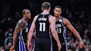 Jan 10, 2025; Boston, Massachusetts, USA; Sacramento Kings forward DeMar DeRozan (10), forward Keegan Murray (13) and forward Domantas Sabonis (11) react after defeating the Boston Celtics at TD Garden. Mandatory Credit: David Butler II-Imagn Images