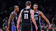 Jan 10, 2025; Boston, Massachusetts, USA; Sacramento Kings forward DeMar DeRozan (10), forward Keegan Murray (13) and forward Domantas Sabonis (11) react after defeating the Boston Celtics at TD Garden. Mandatory Credit: David Butler II-Imagn Images