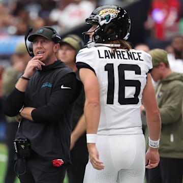 Nov 9, 2025; Houston, Texas, USA; Jacksonville Jaguars head coach Liam Coen and quarterback Trevor Lawrence (16) on the sidelines during the first half against the Houston Texans at NRG Stadium. Mandatory Credit: Thomas Shea-Imagn Images