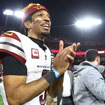 Washington Commanders quarterback Jayden Daniels celebrates after winning wild-card game.