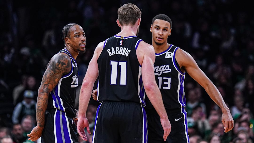 Jan 10, 2025; Boston, Massachusetts, USA; Sacramento Kings forward DeMar DeRozan (10), forward Keegan Murray (13) and forward Domantas Sabonis (11) react after defeating the Boston Celtics at TD Garden. Mandatory Credit: David Butler II-Imagn Images