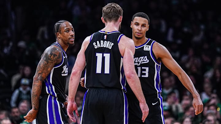 Jan 10, 2025; Boston, Massachusetts, USA; Sacramento Kings forward DeMar DeRozan (10), forward Keegan Murray (13) and forward Domantas Sabonis (11) react after defeating the Boston Celtics at TD Garden. Mandatory Credit: David Butler II-Imagn Images