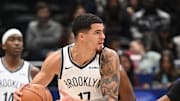 Nov 16, 2025; Washington, District of Columbia, USA;  Brooklyn Nets forward Michael Porter Jr. (17) looks to pass the ball infant to Washington Wizards guard Bilal Coulibaly (0) during the third quarter at Capital One Arena. Mandatory Credit: Rafael Suanes-Imagn Images