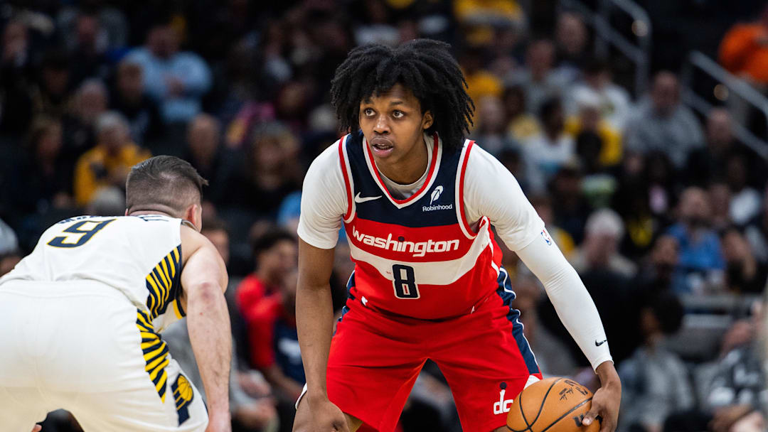 Apr 8, 2025; Indianapolis, Indiana, USA; Washington Wizards guard Bub Carrington (8) dribbles the ball while  Indiana Pacers guard T.J. McConnell (9) defends in the second half at Gainbridge Fieldhouse. Mandatory Credit: Trevor Ruszkowski-Imagn Images