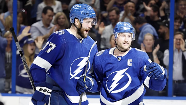 Apr 26, 2022; Tampa, Florida, USA; Tampa Bay Lightning center Steven Stamkos (91) is congratulated by defenseman Victor Hedman (77) after scoring a goal against the Columbus Blue Jackets during the first period at Amalie Arena. Mandatory Credit: Kim Klement-Imagn Images