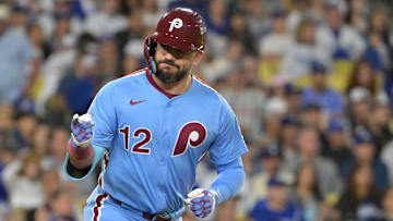 Oct 8, 2025; Los Angeles, California, USA; Philadelphia Phillies designated hitter Kyle Schwarber (12) looks into the dugout after hitting a solo home run during the fourth inning against the Los Angeles Dodgers in game three of the NLDS during the 2025 MLB playoffs at Dodger Stadium. Mandatory Credit: Jayne Kamin-Oncea-Imagn Images