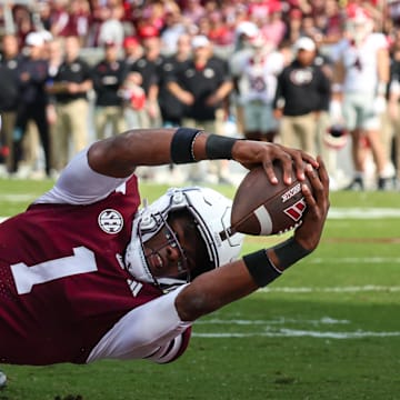 Nov 8, 2025; Starkville, Mississippi, USA; Mississippi State Bulldogs quarterback Kamario Taylor (1) runs for a touchdown against the Georgia Bulldogs during the first half at Davis Wade Stadium at Scott Field. Mandatory Credit: Wesley Hale-Imagn Images