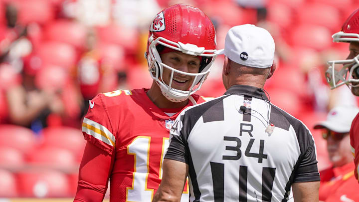 Kansas City Chiefs quarterback Patrick Mahomes (15) talks with referee Clete Blakeman (34) against the Washington Commanders prior to the game at GEHA Field at Arrowhead Stadium.