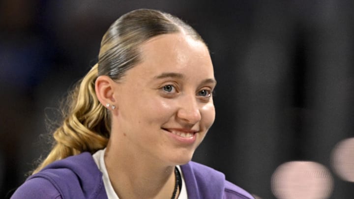 Oct 6, 2025; Fort Worth, Texas, USA; Dallas Wings guard Paige Bueckers (left) talks with TCU women’s basketball coach Mark Campbell (right) during the second quarter at Dickie's Arena. Mandatory Credit: Jerome Miron-Imagn Images