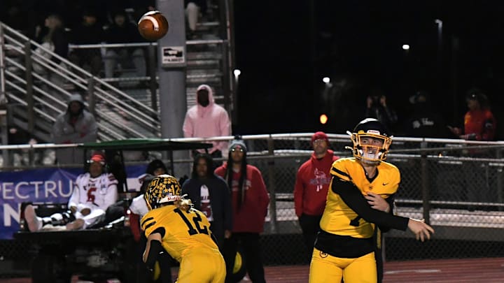 Matt Ponatoski looks to connect on a pass for Moeller in the OHSAA Division I football regional semifinals Nov. 15, 2024, at Dwire Field Mason, Ohio.